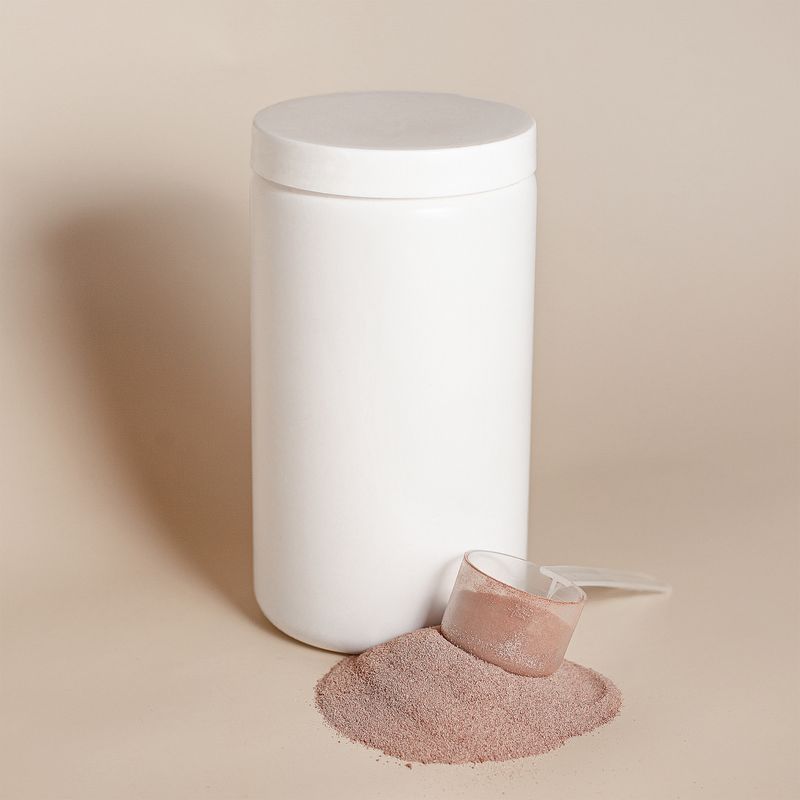 Protein powder with a measuring scoop